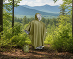 Green emergency poncho with reflective lining on a white background - offered by the best camping and hiking gear store in Vermont, The Adirondack Tool Co. 