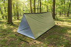 Olive green emergency tent by The Adirondack Tool Co. that is fully deployed and has text showing size dimensions