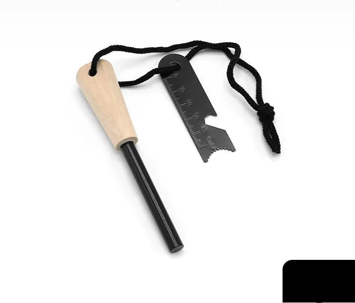 Firestarter multitool with magnesium strip with wooden handle and steel striker stick on a white background - offered by the best camping gear store in New York, The Adirondack Tool Co.