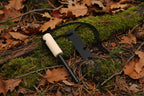 Firestarter multitool with magnesium strip with wooden handle and steel striker stick on a white background - offered by the best camping gear store in New York, The Adirondack Tool Co.