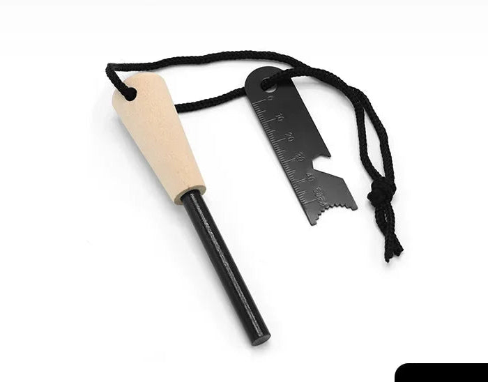 Firestarter multitool with magnesium strip with wooden handle and steel striker stick on a white background - offered by the best camping gear store in New York, The Adirondack Tool Co.