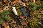 Firestarter multitool with magnesium strip with wooden handle and steel striker stick on a white background - offered by the best camping gear store in New York, The Adirondack Tool Co.
