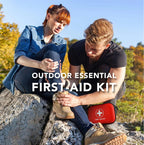 Two people outdoors with a first aid kit offered by the best hiking store in New York, The Adirondack Tool Co.