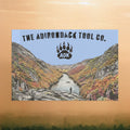 Flag of The Adirondack Tool Co. with a mountain landscape and ADK logo