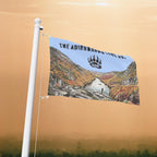 Flag with a scenic design and 'The Adirondack' logo on a flagpole