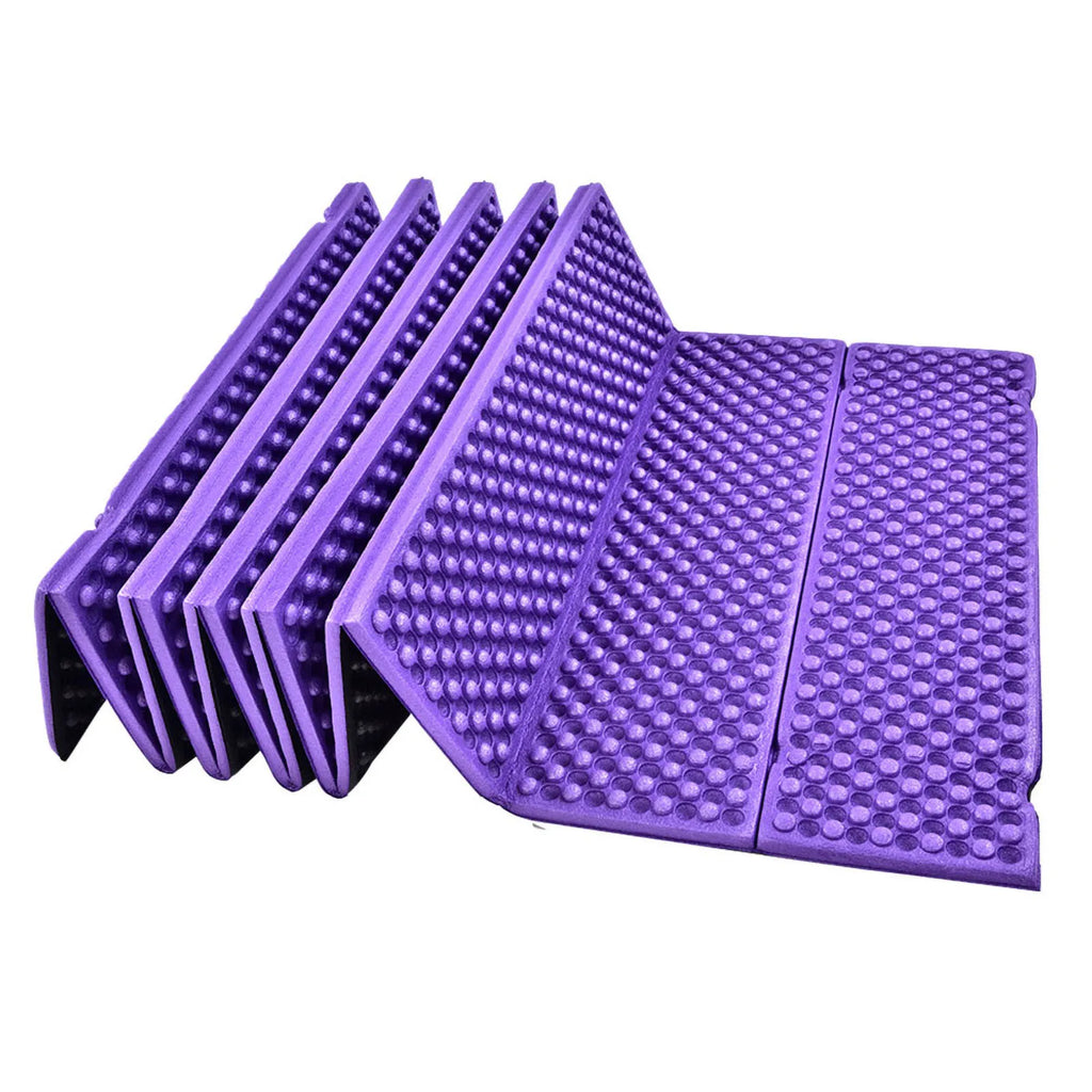 Foldable purple foam sleeping / sitting mat from The Adirondack Tool Co. on a white background