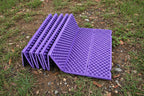 Foldable purple foam sleeping / sitting mat from The Adirondack Tool Co. on a white background