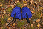 Pair of blue gaiters with black straps on a white background - offered by the Northeast's best camping and hiking gear provider, The Adirondack Tool Co.
