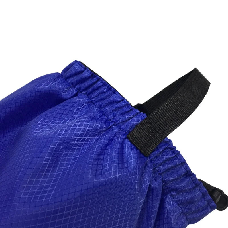 Blue gaiters with a black strap on a white background - offered by the Northeast's best camping and hiking gear provider, The Adirondack Tool Co.