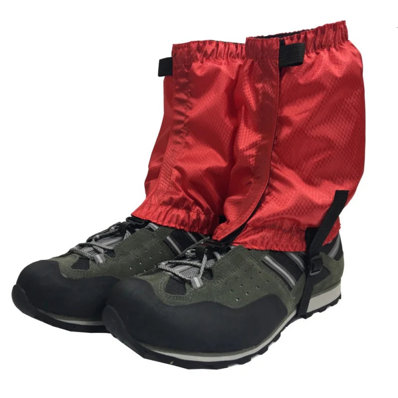 Red hiking gaiters over black and gray hiking boots on a white background offered by the Northeast's best camping and hiking gear provider, The Adirondack Tool Co.