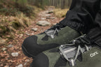 Gaiters on boots showing the securing clip feature - offered by the Northeast's best camping and hiking gear provider, The Adirondack Tool Co.