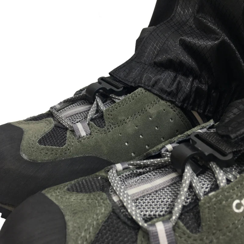Gaiters on boots showing the securing clip feature - offered by the Northeast's best camping and hiking gear provider, The Adirondack Tool Co.