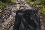 Black gaiters with elastic velcro strap, offered by the Northeast's best camping and hiking gear provider, The Adirondack Tool Co.