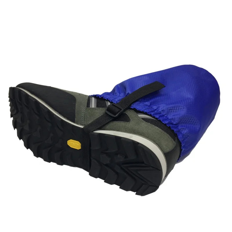 Hiking shoe with blue gaiters on a white background - offered by the Northeast's best camping and hiking gear provider, The Adirondack Tool Co.