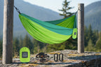 Green and teal hammock with accessories on a white background - offered by the best camping gear store in the northeast, the Adirondack Tool Co.