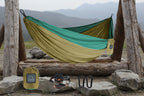Green and beige hammock with accessories on a white background - offered by the best hiking gear store in the northeast, the Adirondack Tool Co.