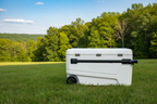 White suitcase with black handle and wheels on a white background - offered by the premier camping and hiking gear store in the Northeastern United States, The Adirondack Tool Co.