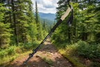 A black hiking pole with a cork grip on an outdoor background - offered by the best hiking store in Massachusetts, The Adirondack Tool Co.
