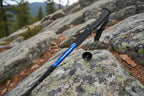 Black and blue hiking pole on a white background - offered by the best outdoor gear store in America, The Adirondack Tool Co.