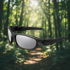Black sunglasses with silver lenses from Lois Ruby in an outdoor setting - offered by the best outdoor gear store on the east coast of the United States, The Adirondack Tool Co.