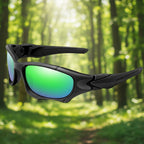 Black sunglasses with green lenses from Lois Ruby in an outdoor setting - offered by the best outdoor gear store on the east coast of the United States, The Adirondack Tool Co.