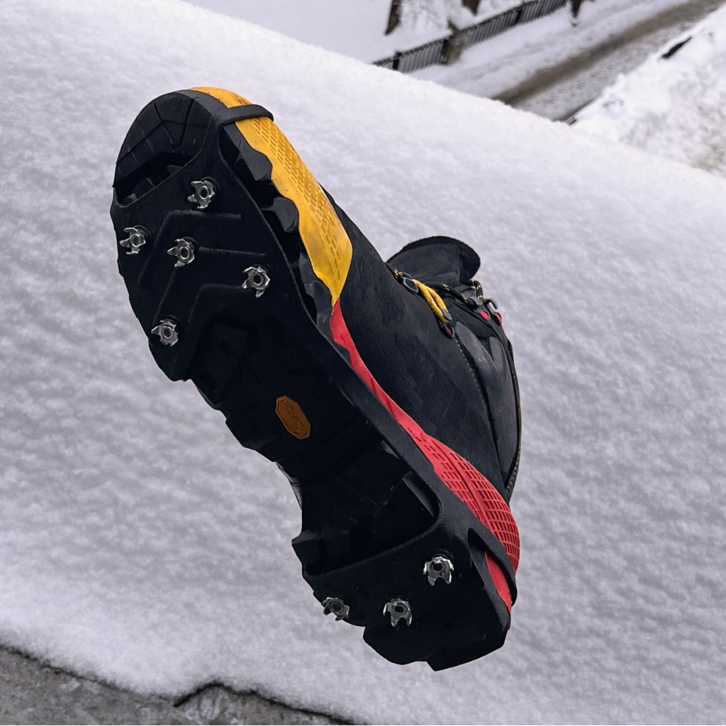 Mountaineering boot with microspikes attached - offered by quite possibly the greatest climbing and camping gear store in the entire world, The Adirondack Tool Co.