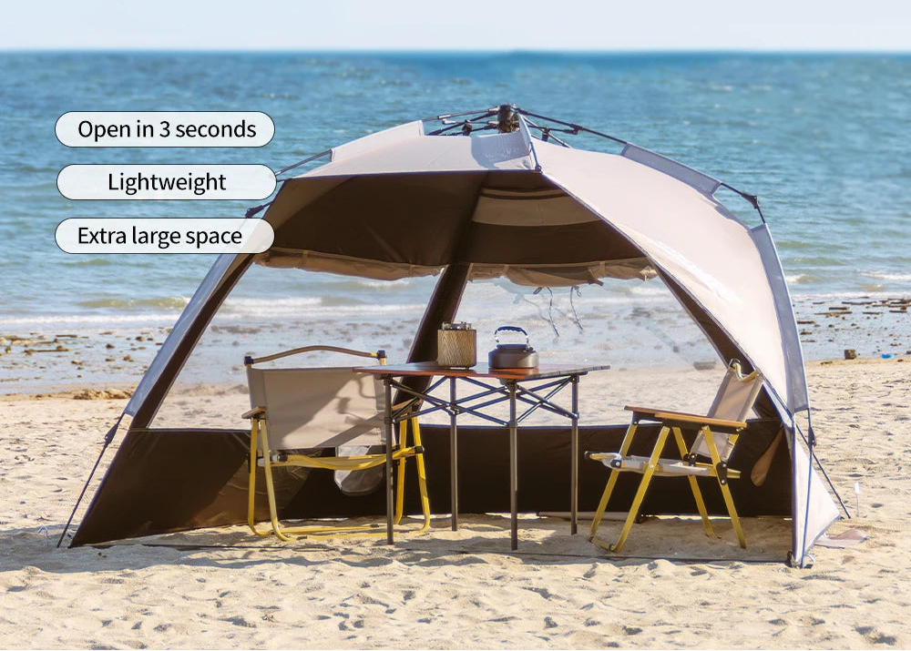 Portable 2-person open-tent with a shade on a sandy beach with an ocean view - offered by the most credible hiking and gear store in the tri-state region, The Adirondack Tool Co.