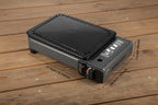 Portable gas-powered stove and grill with dimensions indicated on a white background - offered by The Adirondack Tool Co.