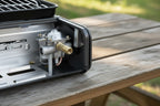 Close-up of a metallic valve mechanism on The Adirondack Tool Co.'s Portable Gas-Powered Stove