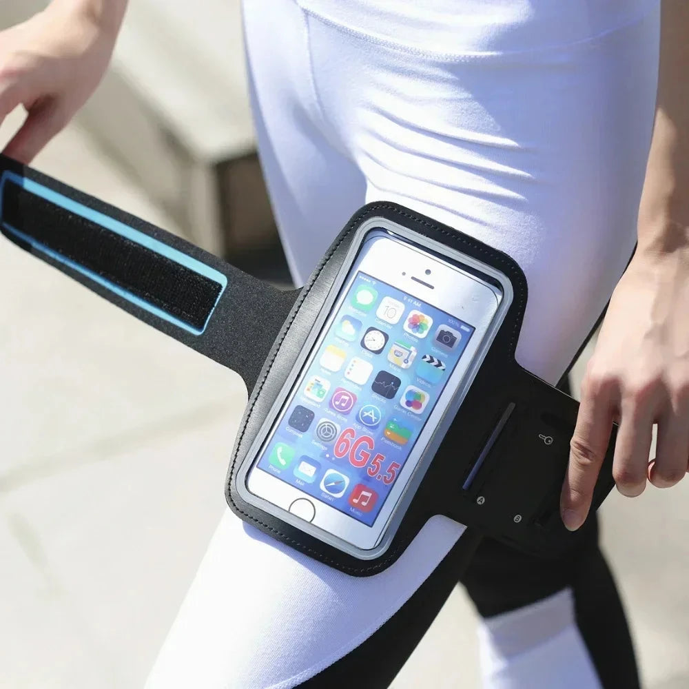 Person wearing a black phone armband with a smartphone displaying app icons - Offered by The Adirondack Tool Co.