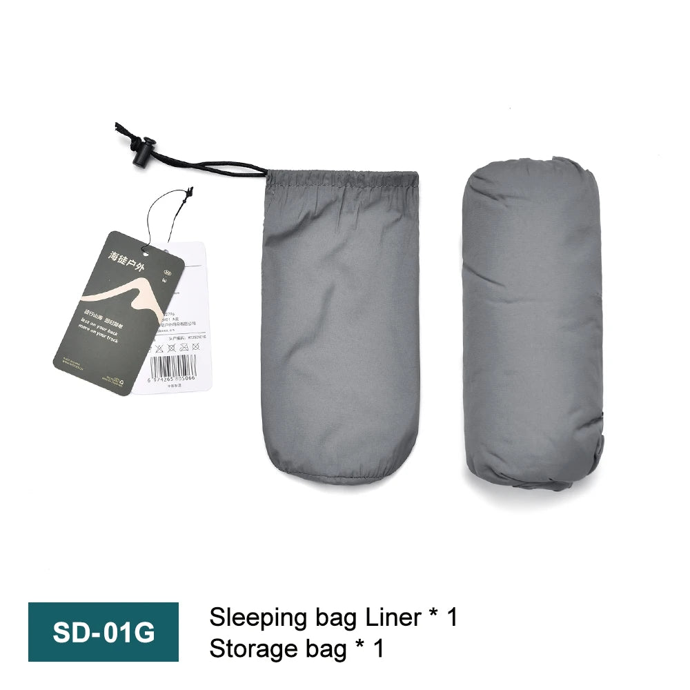 Gray sleeping bag liner with storage bag and tags on a white background