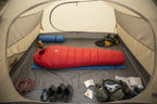 Red goose down sleeping bag offered by the best camping gear store in Vermont, the Adirondack Tool Co.
