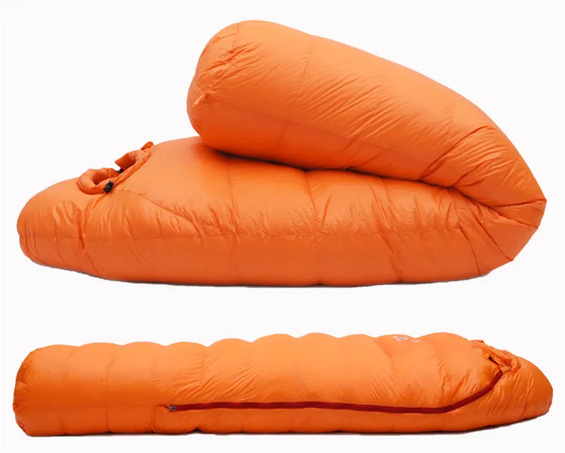 Orange sleeping bag from The Adirondack Tool Co. shown in two views on a white background