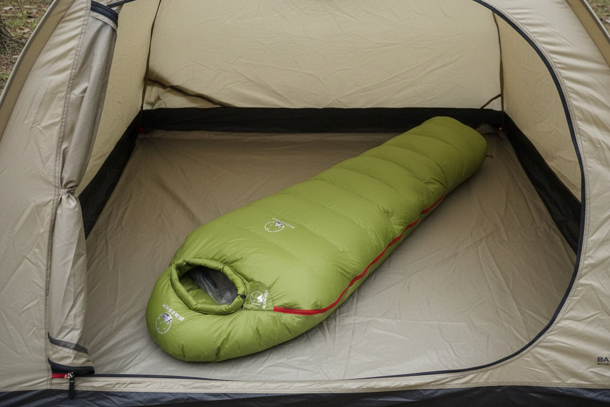 Green goose down sleeping bag offered by the best camping gear store in Vermont, the Adirondack Tool Co.