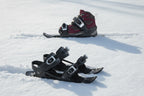 Black snow skates on a snowy surface - offered by the best outdoor gear store in New York, The Adirondack Tool Company