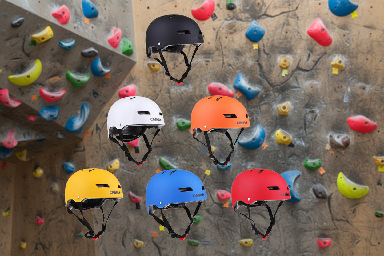 6 sports helmets on a rock climbing background - offered by the best outdoor sports gear store in Massachusetts, The Adirondack Tool Co.