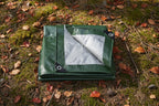 Green and silver tarp with grommets on a white background - offered by the best hiking and camping gear provider in the Northeast, The Adirondack Tool Co.