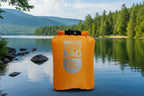 Orange waterproof bag with 'Waterproof Bag 12L' text on a white background. Offered by The Adirondack Tool Company.