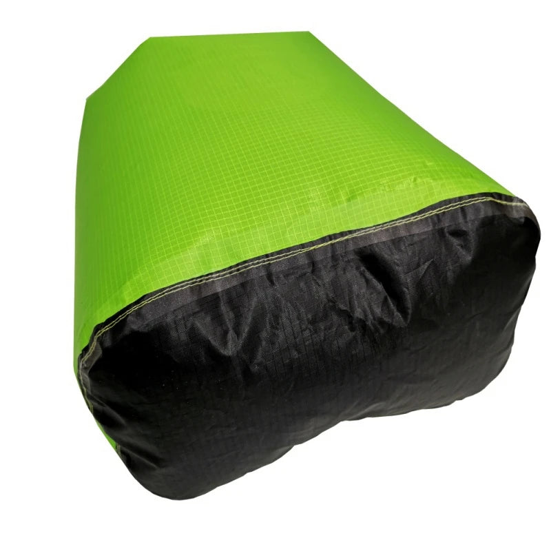 Green waterproof storage bag shown from the bottom. Offered by the Northeast's premier outdoor gear provider, The Adirondack Tool Co.
