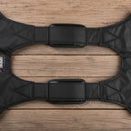 Black cushioned shoulder straps/ harness on a white background - offered by the best hiking store in New York, The Adirondack Tool Company
