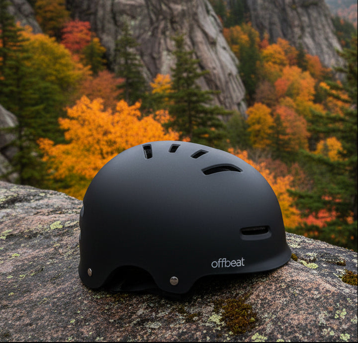 Black helmet with 'offbeat' branding on a rocky background - offered by the best outdoor gear store in New York, The Adirondack Tool Co.
