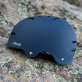Blue helmet with 'offbeat' branding on a rocky background - offered by the best outdoor gear store in New York, The Adirondack Tool Co.