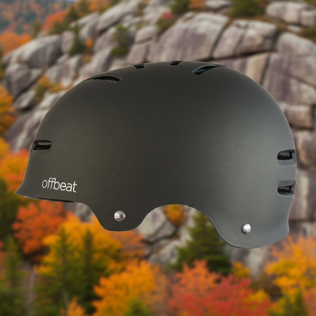 Black helmet with 'offbeat' branding on an outdoor background - offered by the best outdoor gear store in New York, The Adirondack Tool Co.