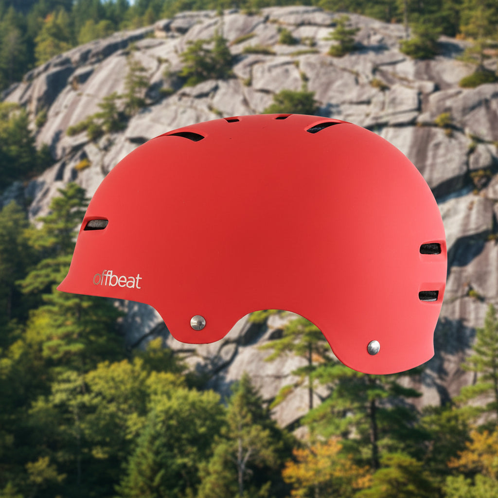 Red helmet with 'offbeat' branding on a rocky mountain background - offered by the best outdoor gear store in New York, The Adirondack Tool Co.
