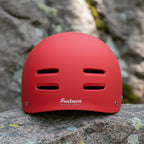 Red helmet with 'Freetown' branding on a rocky background - offered by the best outdoor gear store in New York, The Adirondack Tool Co.
