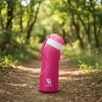 Pink water bottle with a white cap and Qunature logo on a hiking trail background - offered by the best hiking gear store in New York, The Adirondack Tool Co.