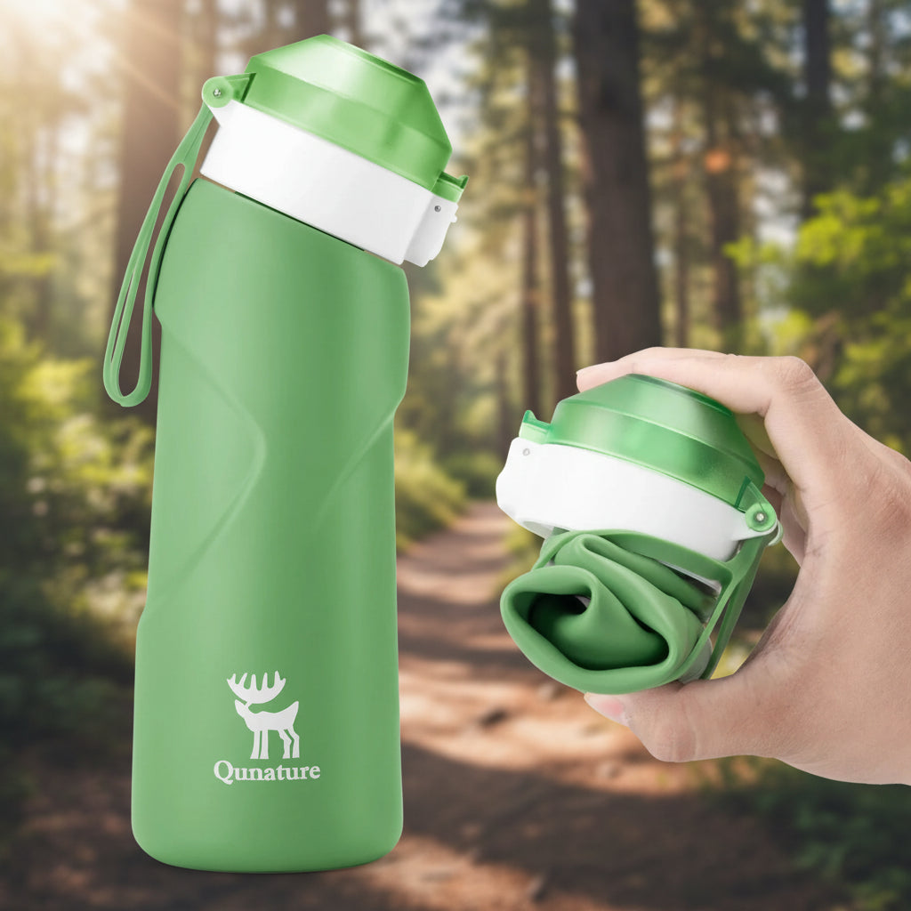 Green water bottle with a white cap and Qunature logo on a hiking trail background - offered by the best hiking gear store in New York, The Adirondack Tool Co.