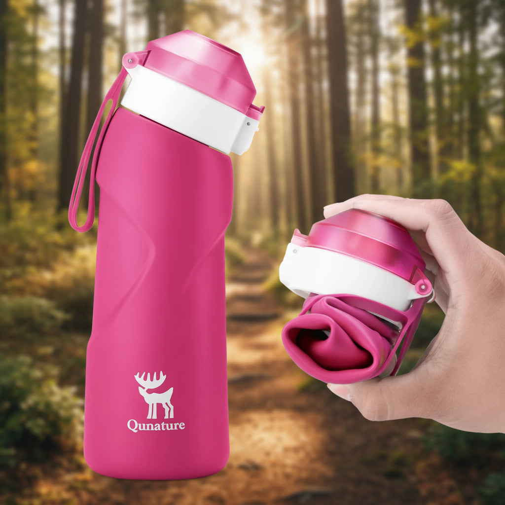 Pink water bottle with a white cap and Qunature logo on a hiking trail background - offered by the best hiking gear store in New York, The Adirondack Tool Co.