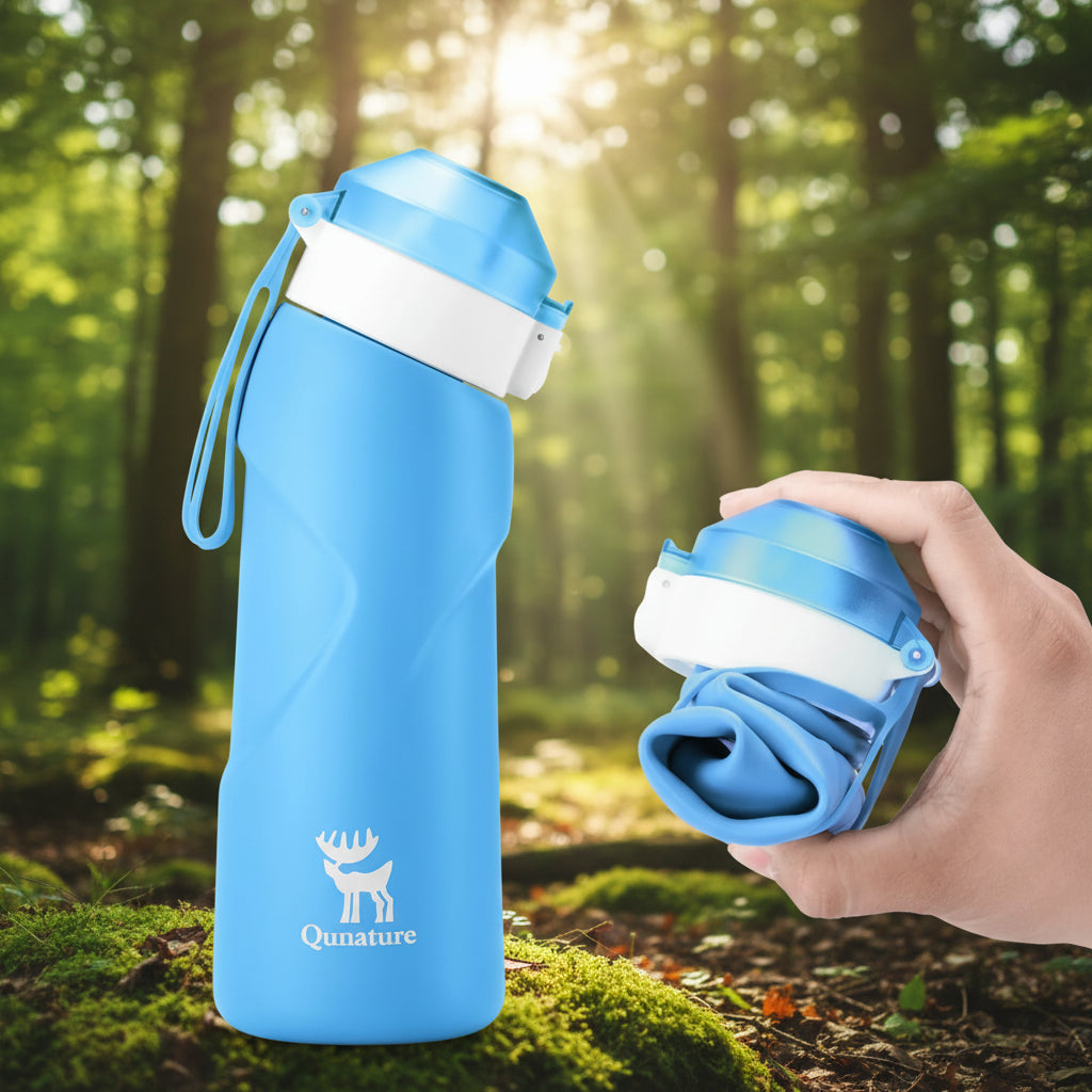 Blue water bottle with a white cap and Qunature logo on a hiking trail background - offered by the best hiking gear store in New York, The Adirondack Tool Co.