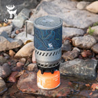 Portable stove with topographic design and brand logo on a rocky background - offered by the best camping gear store in Pennsylvania, The Adirondack Tool Co.